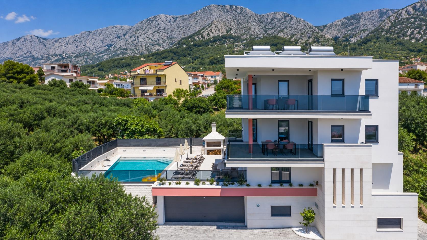 Villa VID in Makarska with a private pool and Biokovo mountains in the background.